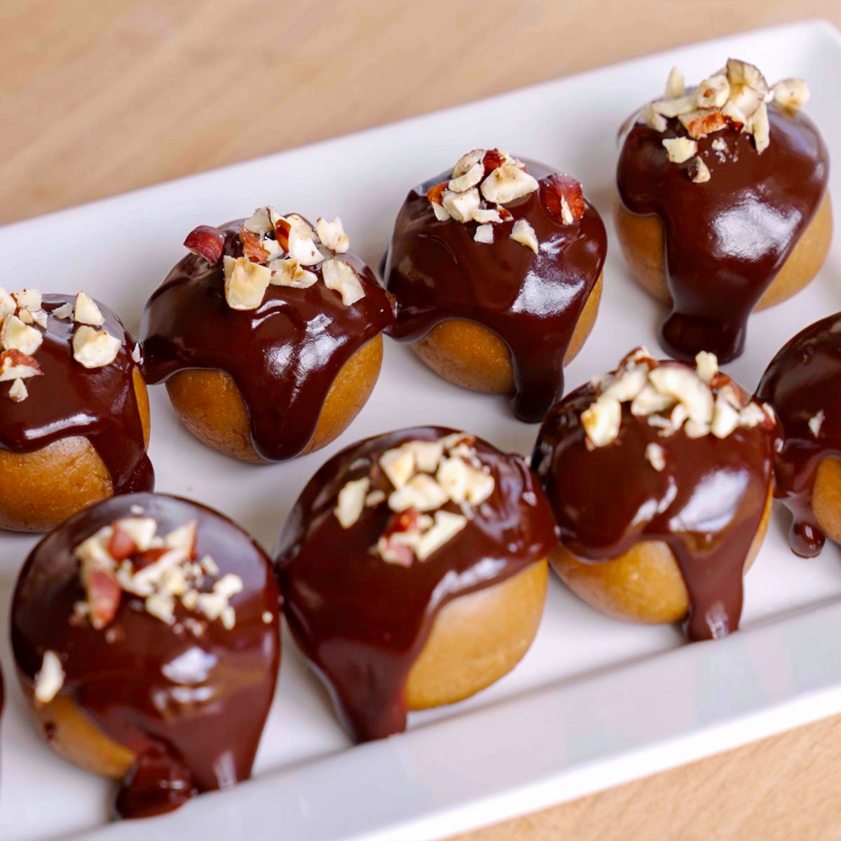 Image of Turtle Cookie Balls, cookies balls filled with Hazelnut spread or Nutella and covered with chocolate and chopped hazelnuts