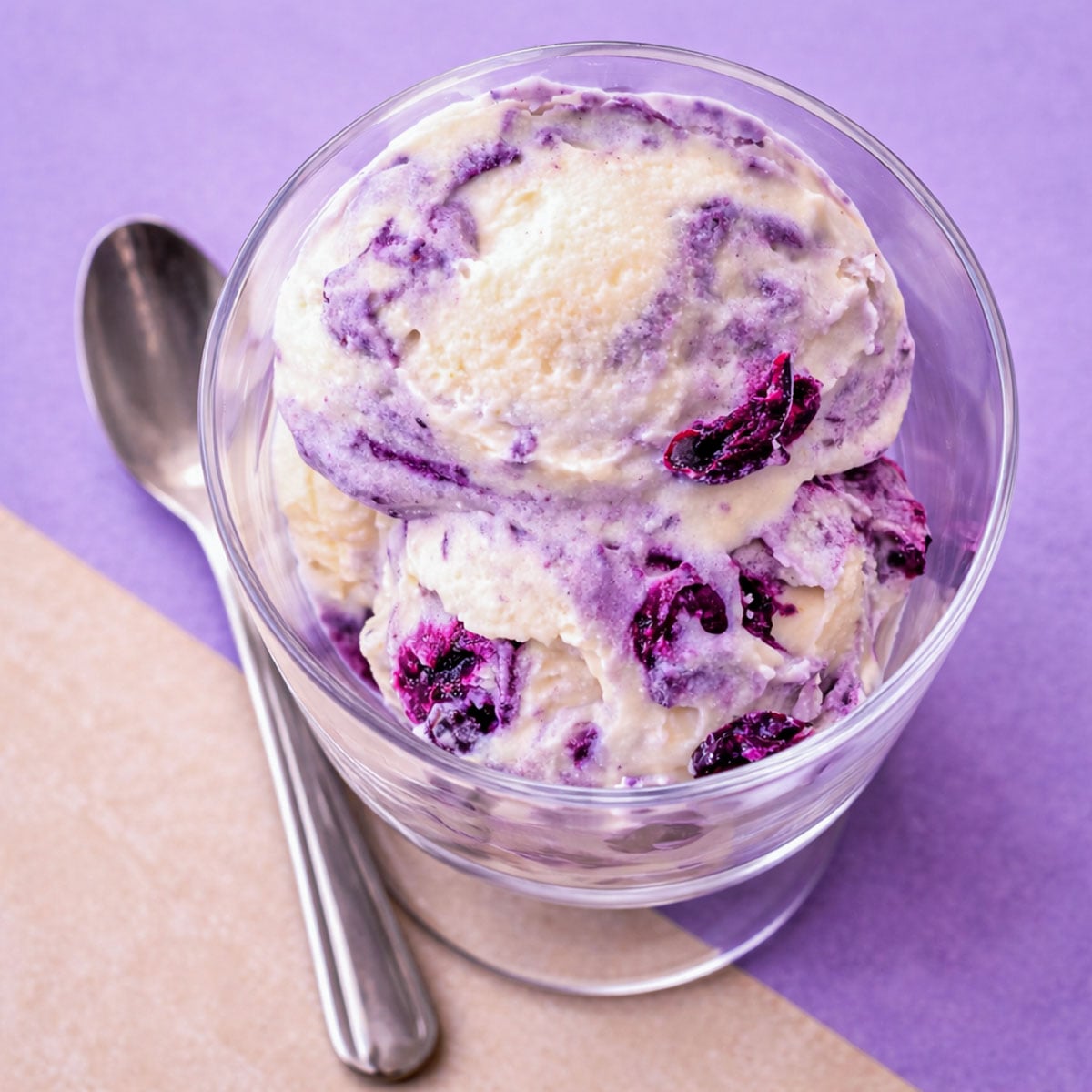 Top View of No-Churn Blueberry Ice Cream in Glass Cup with Creamy Vanilla Base and Blueberry Compote Swirls