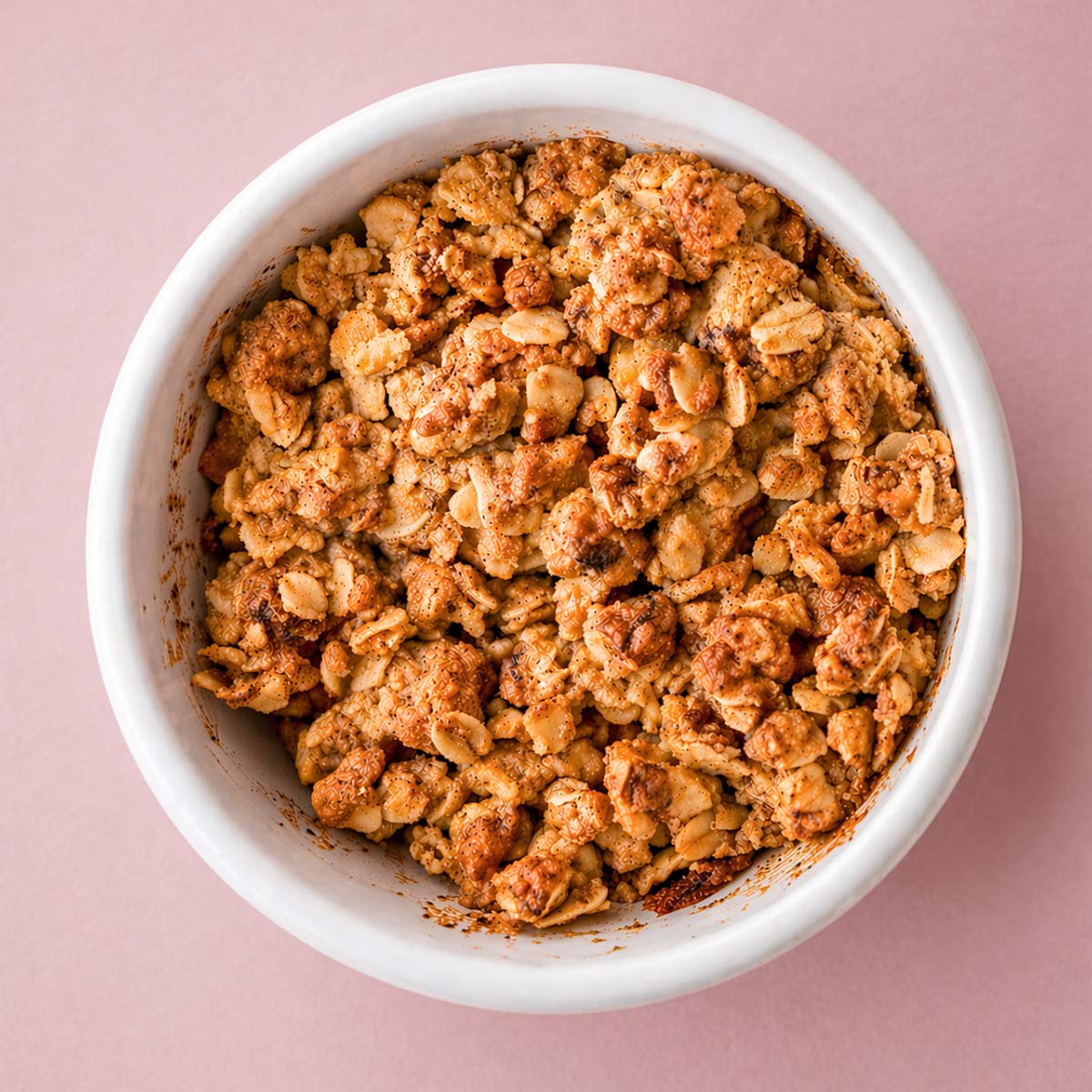 apple crisp with oat topping in a white ramekin, golden brown crumble