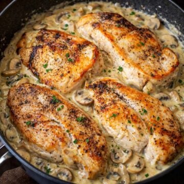 Easy Chicken and Mushrooms Skillet with creamy mushroom sauce and seared chicken breasts cooked in a skillet