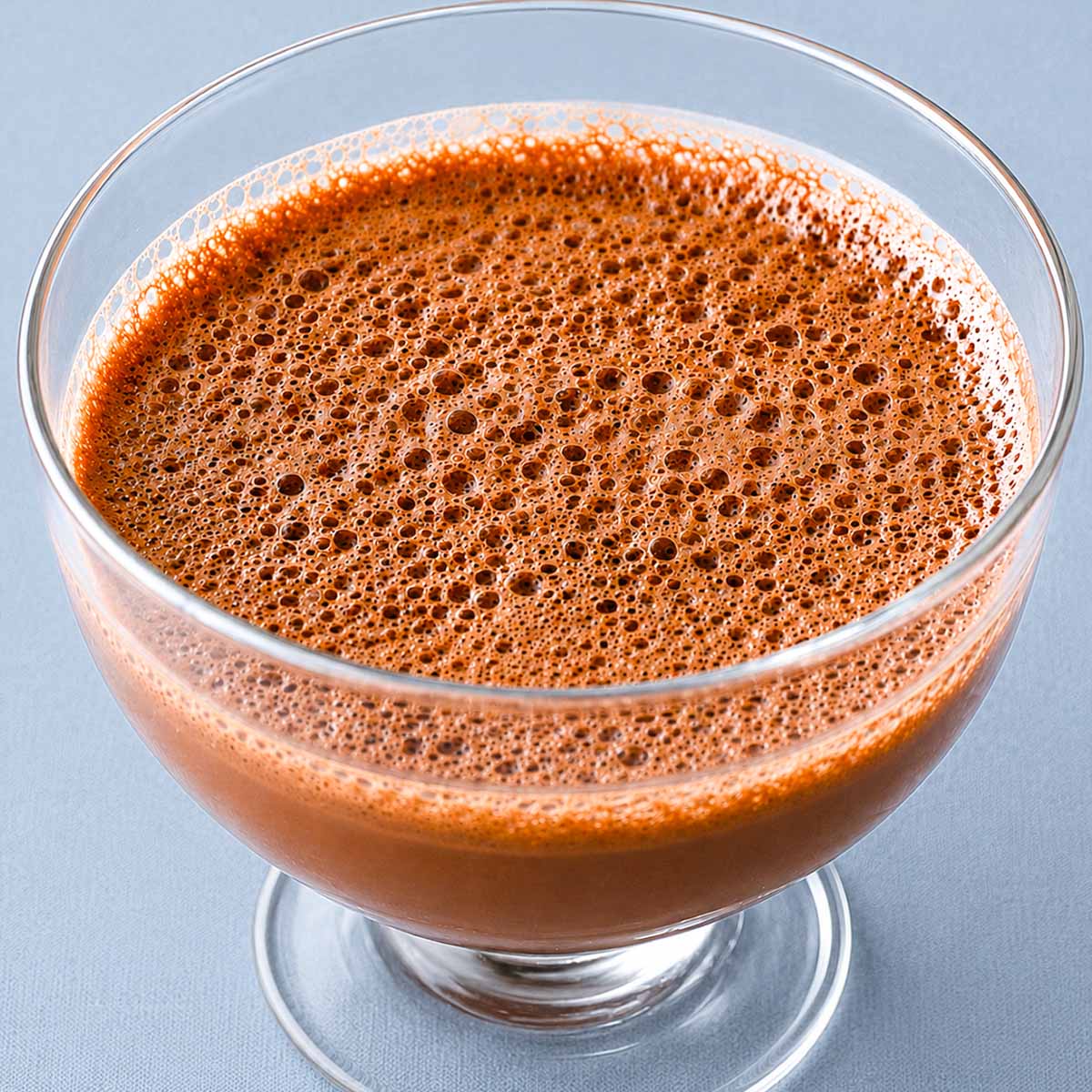 2 Ingredient Chocolate Mousse in a glass dessert bowl with a light, airy texture and rich chocolate foam on top.