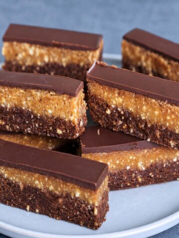 Bajadera Recipe (No-Bake Croatian Chocolate Bars) on a plate with layered chocolate, biscuit, and nut filling