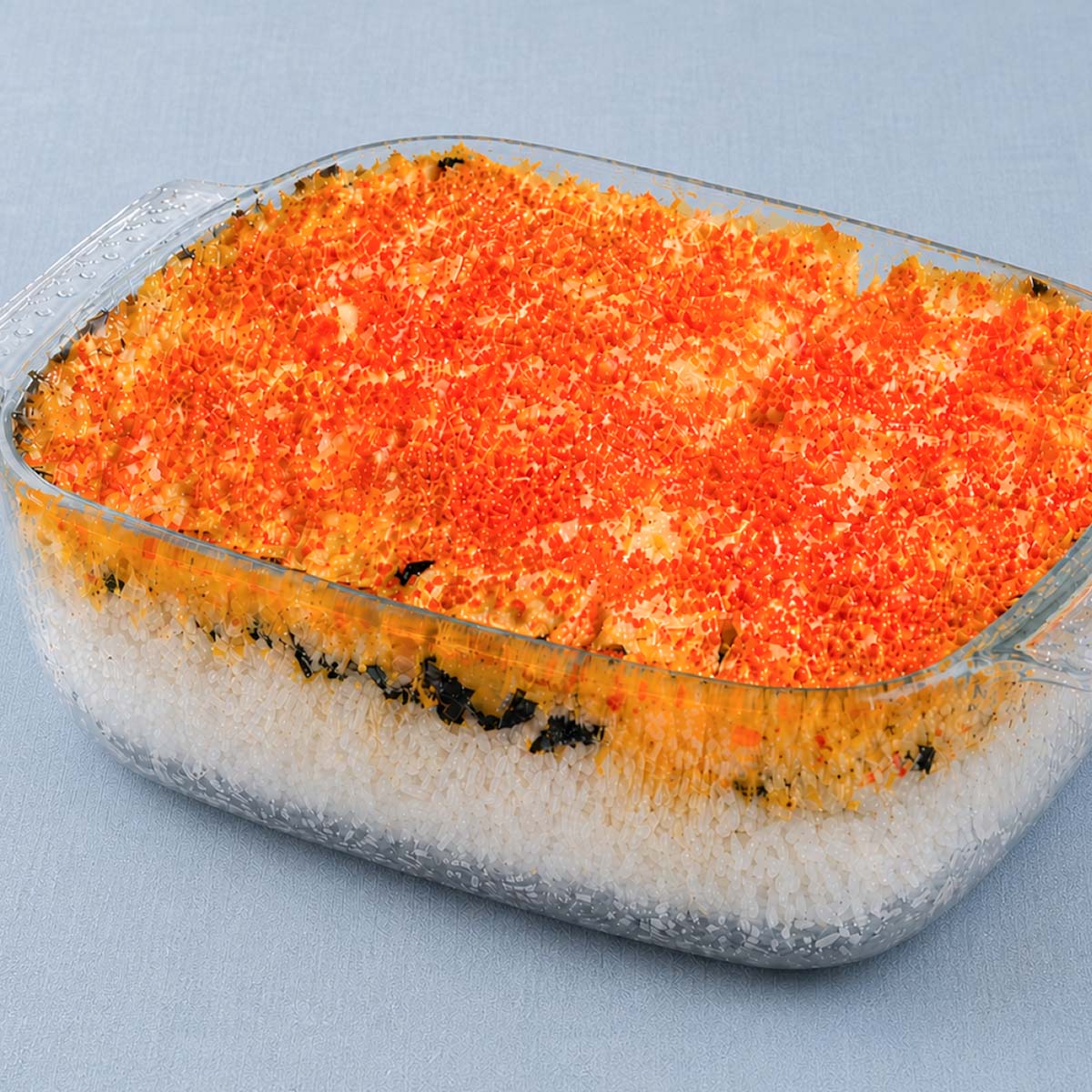 easy salmon sushi bake in glass dish with rice layers, nori, creamy topping and caviar