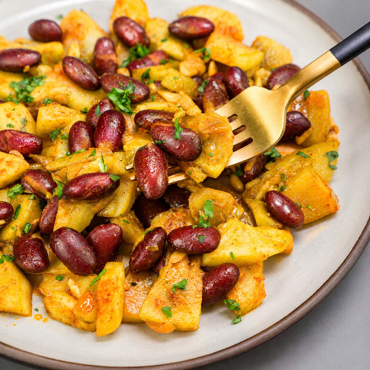 close up Sauteed summer squash with red kidney beans, onions, garlic, and fresh parsley