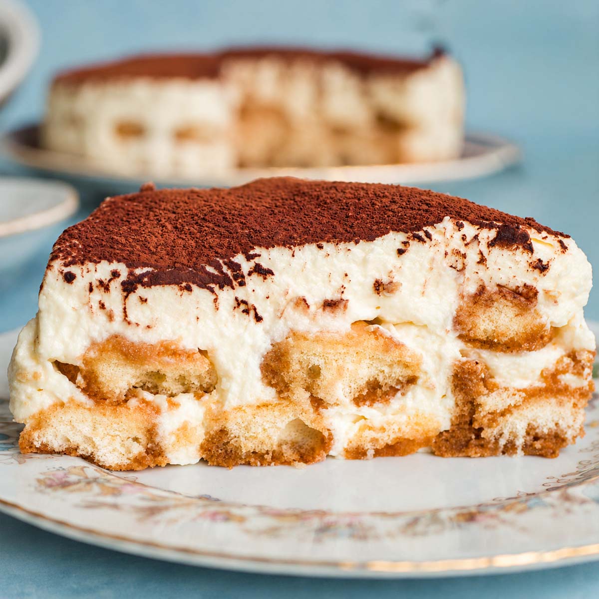 Easy homemade tiramisu with creamy mascarpone filling, cocoa powder topping, and soft coffee-soaked ladyfingers