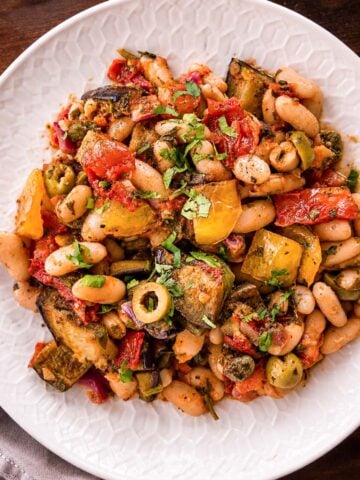 White Bean Eggplant Caponata with roasted eggplant, white beans, peppers, olives, and fresh parsley