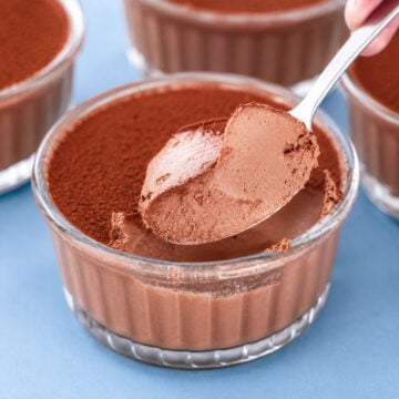 2 Ingredient Chocolate Dessert served in glass ramekins with a creamy chocolate mousse texture and cocoa powder topping