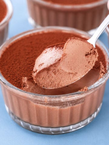 2 Ingredient Chocolate Dessert served in glass ramekins with a creamy chocolate mousse texture and cocoa powder topping