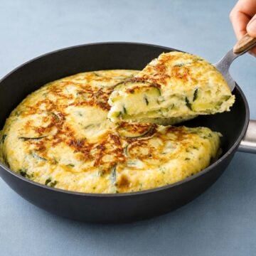 Zucchini Frittata in Skillet with Golden Cheese Crust and Creamy Zucchini Filling