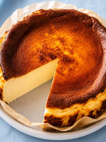 Whole Basque burnt cheesecake with a creamy center and deeply caramelized top