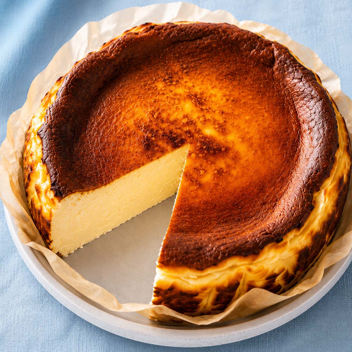 Whole Basque burnt cheesecake with a creamy center and deeply caramelized top