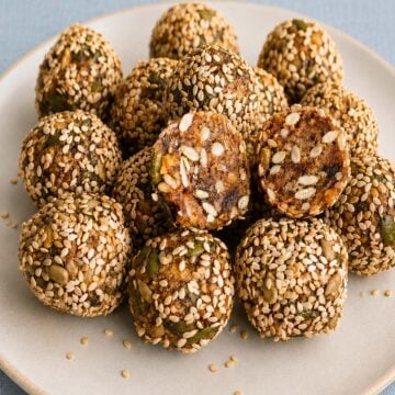 Close-up of sesame date balls with walnuts and sunflower seeds