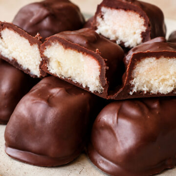 Close-up of 3 ingredient Mounds bars showing the chewy coconut center inside a chocolate shell