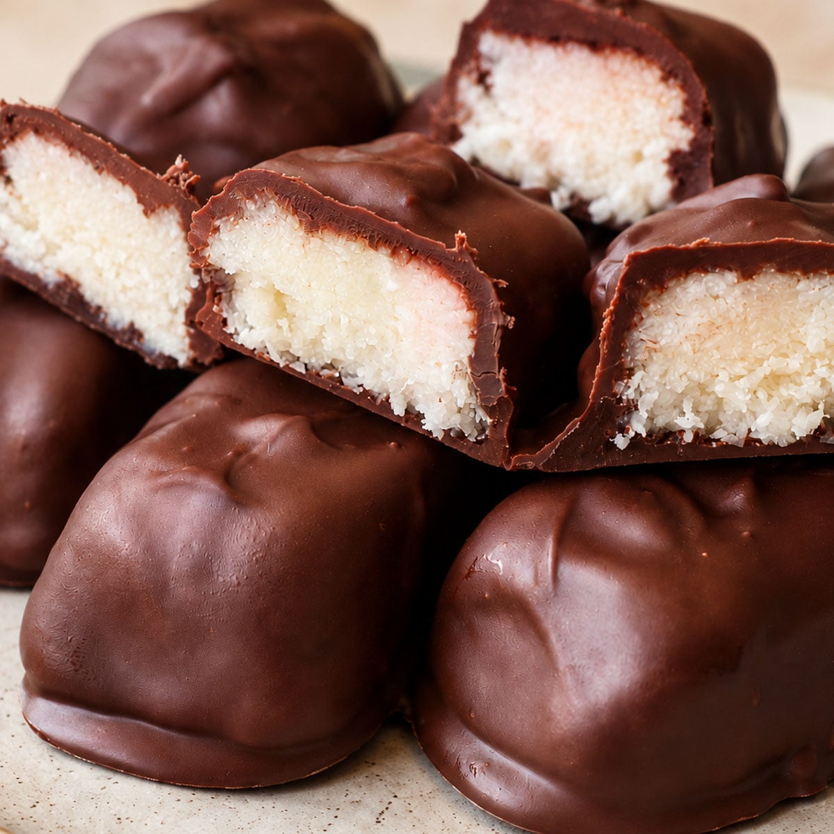 Close-up of 3 ingredient Mounds bars showing the chewy coconut center inside a chocolate shell