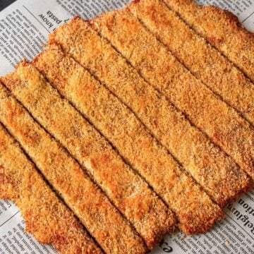 Close-up of sliced 4 ingredient ground chicken cutlets with a crisp panko coating.