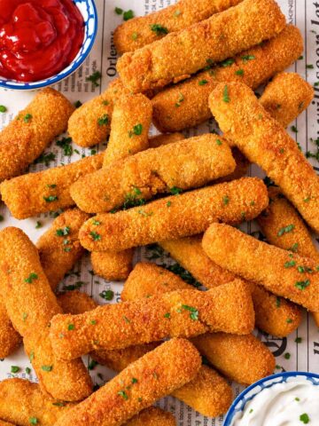 Crispy homemade chicken fries with ketchup and creamy dipping sauce