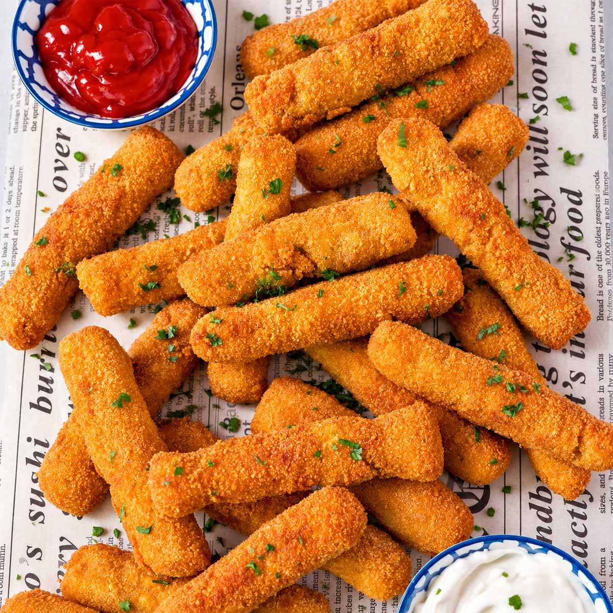Crispy homemade chicken fries with ketchup and creamy dipping sauce
