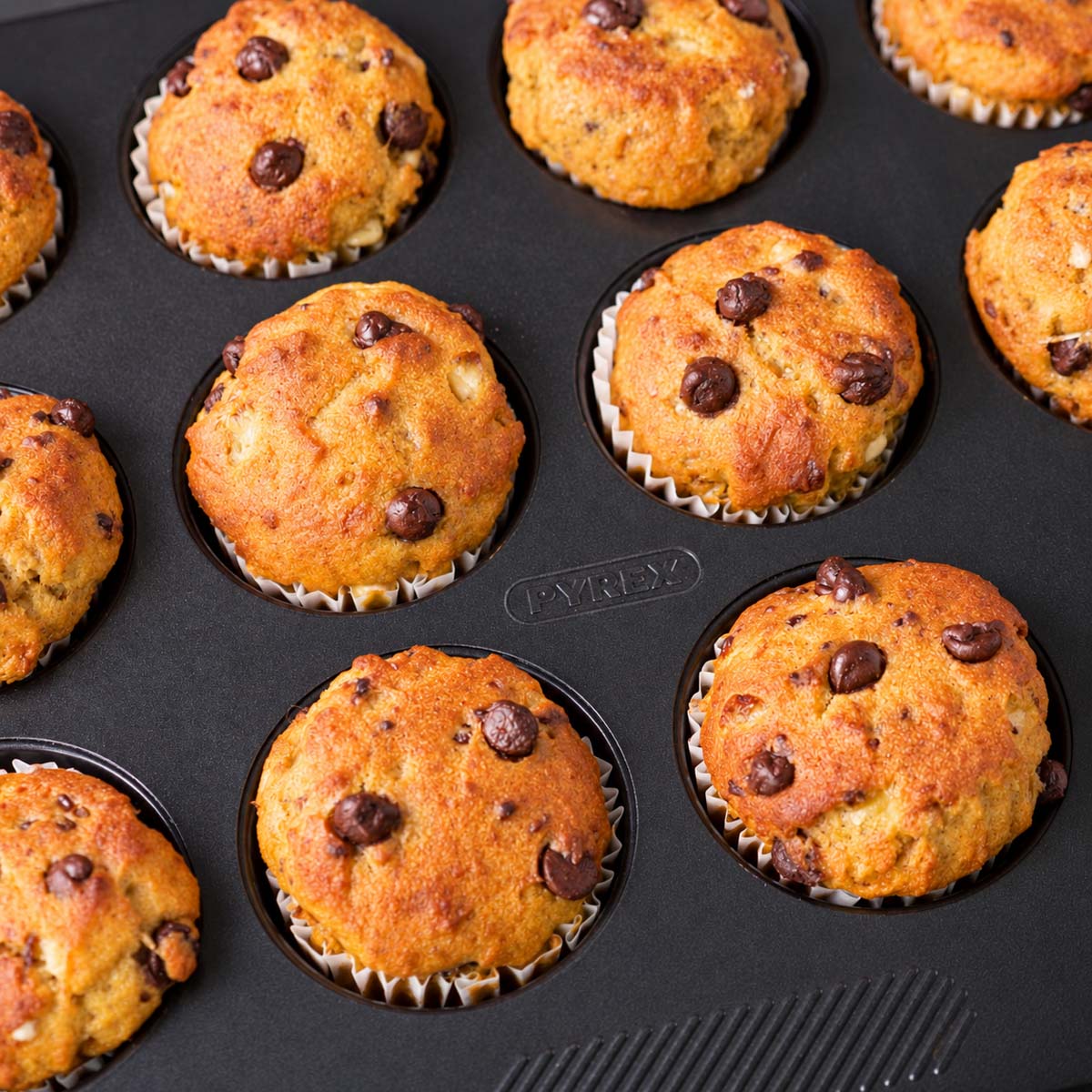 Cottage cheese pumpkin muffins with chocolate chips baked in a muffin tin.