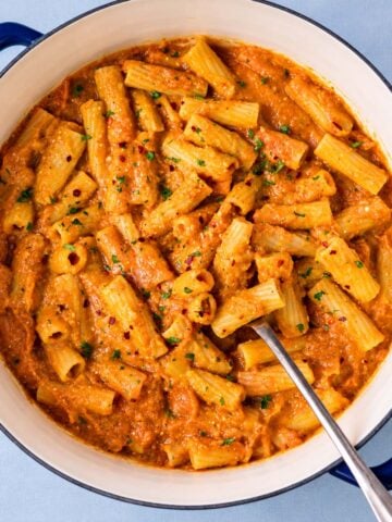 One pot pumpkin pasta with rigatoni coated in a creamy pumpkin sauce and sprinkled with fresh parsley and chili flakes.